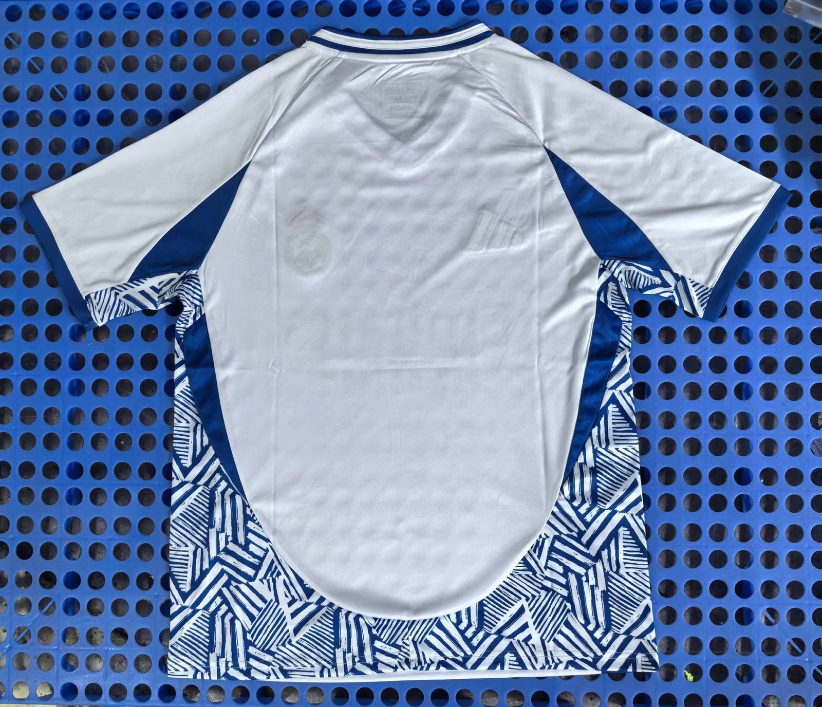 Real Madrid's blue and white training jersey