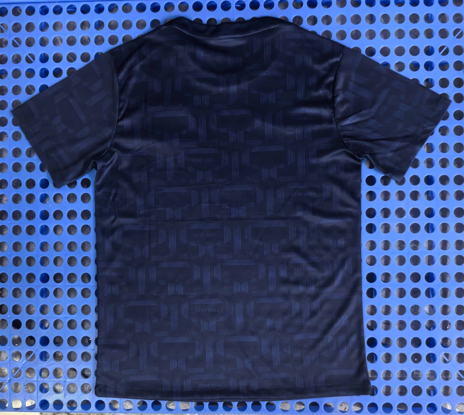 Barcelona's navy blue training jersey